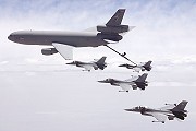 6603 (93-0704), 6607 (93-0708), 6610 (93-0711), and 6620 (93-0721) flying in formation with a USAF KC-10